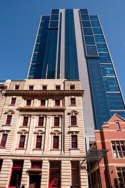 Brookfield Place towering above heritage buildings in the CBD. Built during the late 2000s mining boom, it is tenanted by the mining company BHP.