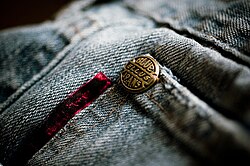 Copper rivets for reinforcing pockets are a characteristic feature of blue jeans.