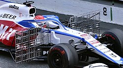 A Formula One car during testing with frames holding many pitot tubes