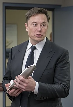 SpaceX CEO Elon Musk holding a model of BFR (Prior name of upper stage of Starship vehicle)