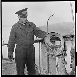 Captain Erling Erichsen, Donau's former commander, assessing the condition of the wreck after she was raised in 1952