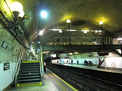 Yellow platform edges, yellow staircase steps and yellow railings, painted for safety, at the IRT Broadway–Seventh Avenue Line platform at 168th Street