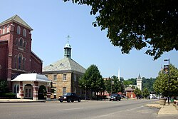 The south side of West Main Street. The square building left of center is a replica of Ohio's first capitol building and serves as the office of the Chillicothe Gazette.
