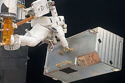 COSTAR being removed by astronaut Andrew J. Feustel during SM4 in 2009