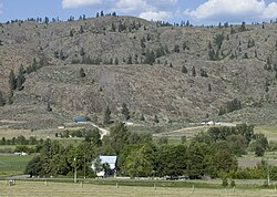 A farm and barren hills near Riverside, in north-central Washington