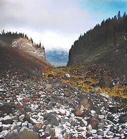 A glaciated valley in the Mount Hood Wilderness showing a characteristic U-shape, the bottom's rocky 'rubble' accretion and the broad shoulders