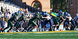 A football game between the Wildcats (right) and William & Mary Tribe at Zable Stadium in 2022