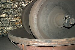 Edge-runner mill in a restored mill, at The Hagley Museum