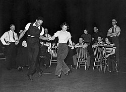 Choreographer Clarence Yates rehearses a musical sequence with Olive Stanton for the Federal Theatre Project production of The Cradle Will Rock (1937)