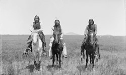 Three mounted Comanche warriors, left, Frank Moetah. Photo by James Mooney, 1892