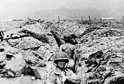 French troops seeking cover in trenches.