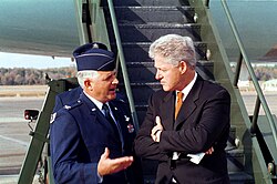 Col. Paul Fletcher, USAF and Clinton speak before boarding Air Force One, November 4, 1999.