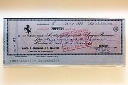 A cheque signed by Enzo Ferrari in the collection of the Museo Ferrari, showing CMC-7 markings