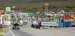 Clustered commercial strips like this one in Breezewood, Pennsylvania are common in outer rural exurbs and suburbs in metropolitan areas.[51]