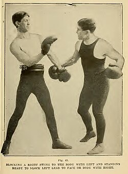 Boxer (left) using a low parry.