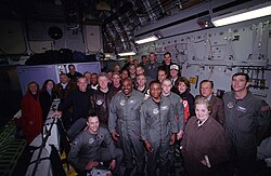 Clinton with the U.S. delegation to Bosnia and Air Force personnel in a flight to Tuzla on December 22, 1997. Clinton is seen alongside future 46th president Joe Biden.