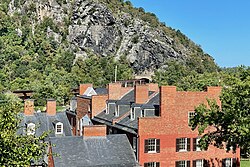 A much faded Mennen's Borated Talcum Toilet Powder advertisement on the cliff face of Maryland Heights opposite Harpers Ferry