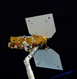Deployment of the Earth Radiation Budget Satellite on STS-41-G, collecting data on Earth's weather and climate