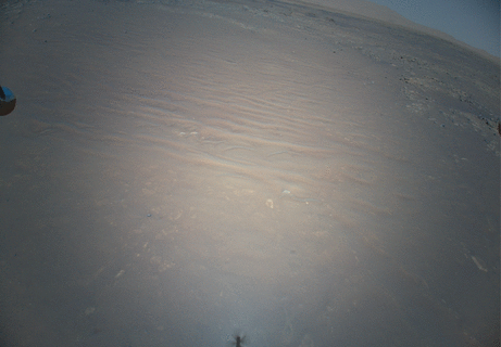 First self-propelled flying extraterrestrial probe Ingenuity on Mars, hovering over its surface and being watched by its parent rover Perseverance rover.