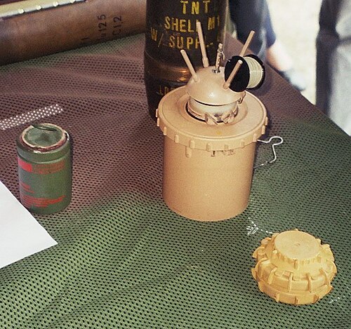 Examples of anti-personnel mines. Center: Valmara 69 (a bounding mine); right: VS-50
