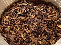 Ready rubbed pipe tobacco inside a round 100g tin