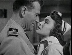 John Wayne and Patricia Neal