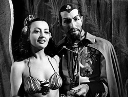 The Yellow Peril Future: In Flash Gordon Conquers the Universe (1940), Ming the Merciless (Charles Middleton) and a concubine (Carmen D'Antonio).