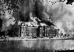 The Metropolitan Police headquarters ablaze following the earthquake. The fire triggered by the earthquake caused fire whirls.
