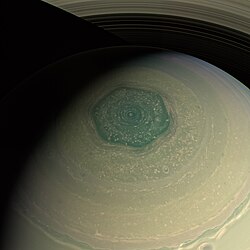 A photo looking down on Saturn's north pole showing a large hexagonal feature