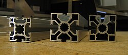 Extruded aluminum with several hollow cavities; T slots allow bars to be joined with special connectors.