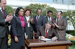Coretta Scott attends the signing of Martin Luther King Jr. Day by President Ronald Reagan on November 2, 1983