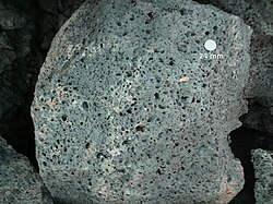 Vesicular basalt at Sunset Crater, Arizona. US quarter (24mm) for scale.