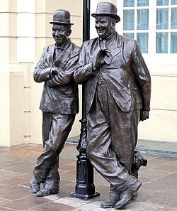 Statue of Stan Laurel and Oliver Hardy outside the Coronation Hall, Ulverston, Cumbria, England