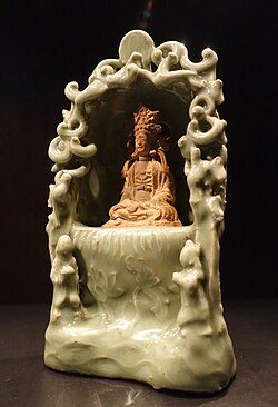 Chinese celadon shrine; coloured glaze, with the figure left unglazed. Ming dynasty, 1300-1400