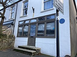 Mrs Pratchett's former sweet shop in Llandaff, Cardiff, has a blue plaque dedicated to Dahl. His autobiography Boy: Tales of Childhood recalls the prank he and his friends played on her using a jar of gobstoppers.[29]