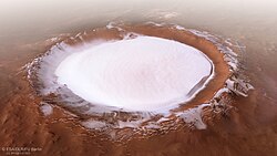 As top surface layer water appears readily visible at some places on Mars, as in this polar crater called Korolev, seen here in 3D projection.