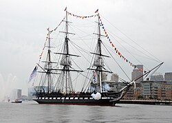USS Constitution, firing a 17-gun salute in 2014