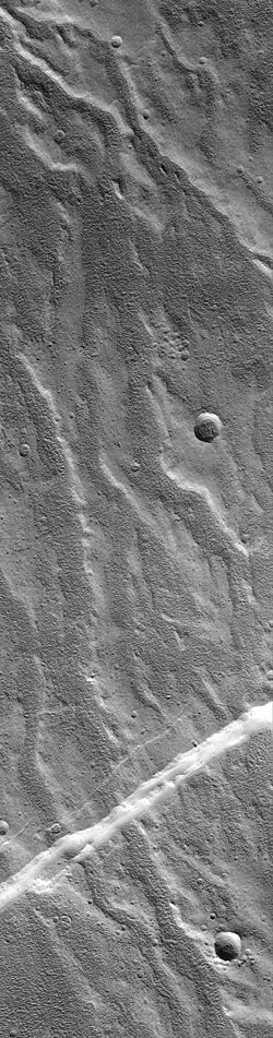 High resolution view of valley network on NW flank of Alba Mons. Younger fault crosscuts the valleys. Image is about 3 km (1.9 mi) across. (Mars Global Surveyor, MOC-NA)