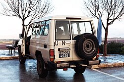 A UN Toyota Land Cruiser parked near Majdal Shams displaying UNDOF plates and a UN flag, January 2012