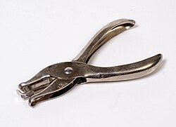 Common handheld single-hole punch