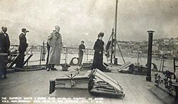 Empress Maria and Grand Duke Nicholas on board HMS Marlborough leaving Russia forever with Yalta in the distance