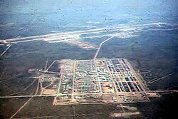 Camp Friendship viewed from the air in 1964 with Korat Air Base at the top of the photo, however much of the support base is not yet constructed
