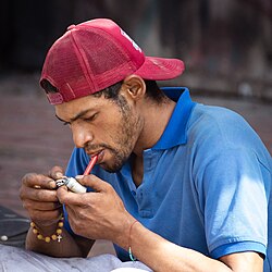 Man smoking crack cocaine in Bogotá, Colombia