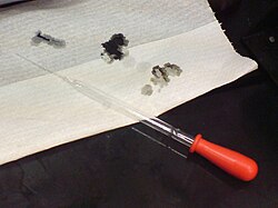 Drops of 98% sulfuric acid char a piece of tissue paper instantly. Carbon is left after the dehydration reaction, staining the paper black.