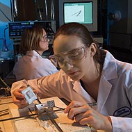 A chemist prepares a new fuel cell for testing at Argonne National Laboratory, Lemont, Illinois.