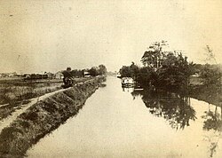 The Miami and Erie Canal as seen from a bridge at Ford Street in Maumee around 1900