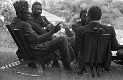 Henry Kissinger meeting with President Mobutu Sese Seko and others at the Presidential Residence in Kinshasa, Zaire