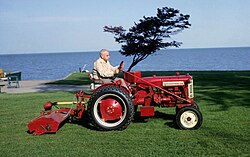 Yellow shaft provides PTO drive to a flail mower on this International Harvester tractor