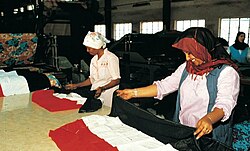 Yemeni women sewing flags