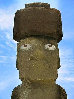 Tuff moai with red scoria pukao on its head.